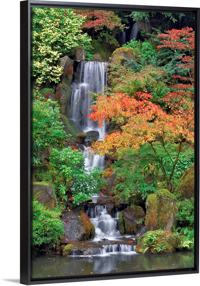 Photograph of waterfall surrounded by autumn trees.