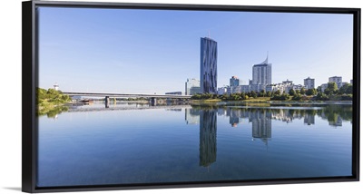 Austria, Vienna, Donau City reflecting in New Danube River