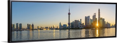 China, Shanghai, Skyline of the Financial District across Huangpu River at sunrise
