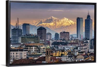City skyline at sunset with the snowy Alps in the background, Milan, Lombardy, Italy