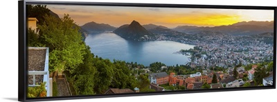 Elevated view over Lugano illuminated at sunset, Lake Lugano, Ticino, Switzerland