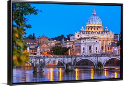 Italy, Rome, St. Peter Basilica by night reflecting on Tevere river