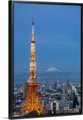 Japan, Tokyo, elevated night view of the city skyline and iconic illuminated Tokyo Tower