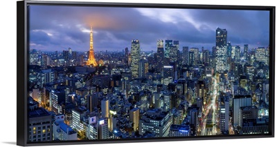 Japan, Tokyo, elevated night view of the city skyline and iconic illuminated Tokyo Tower