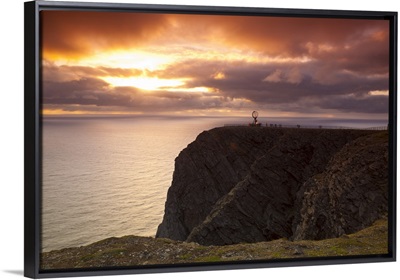 The Midnight Sun breaks through the clouds at Nordkapp, Finnmark, Norway