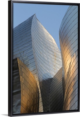 Titanium-clad exterior of the Guggenheim museum at sunset, Bilbao, Biscay, Spain