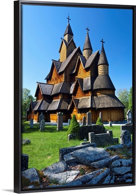 Tourists checking map beside Heddal Stave Church, Norway