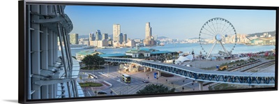 View of Star Ferry pier, observation wheel and Tsim Sha Tsui skyline, Hong Kong, China