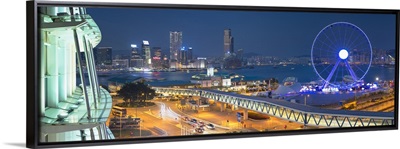 View of Star Ferry pier, observation wheel and Tsim Sha Tsui skyline, Hong Kong, China