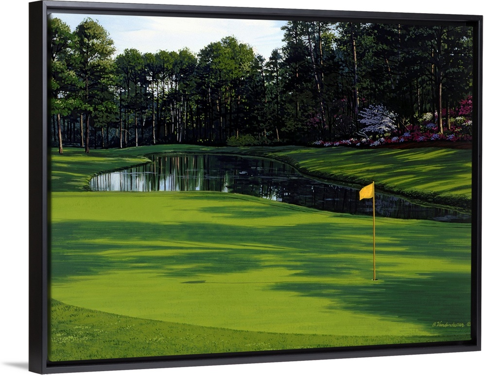 Photograph of the greenway on a golf course with a small pond and trees just behind it.