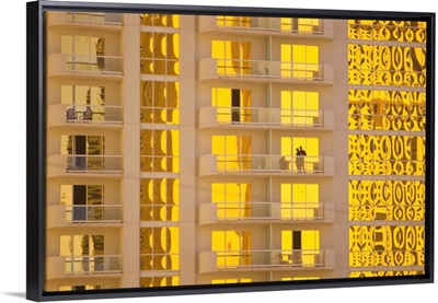 Sunlight reflects bright gold on high rise casino windows