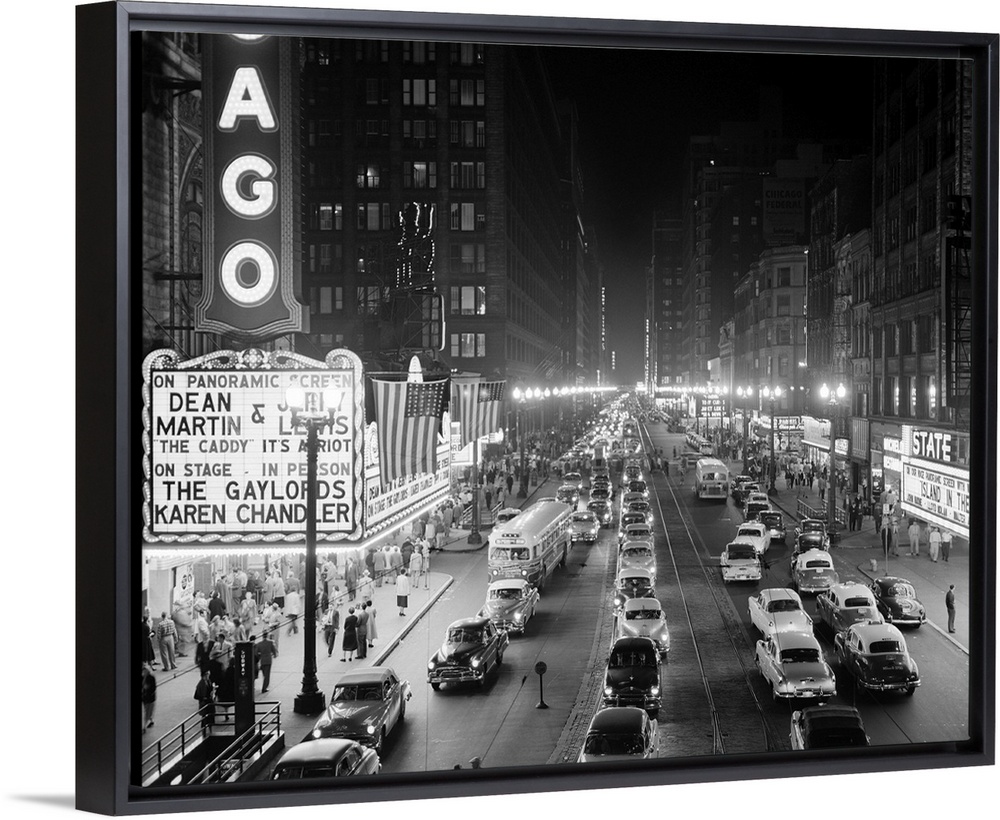 1950's 1953 Night Scene Of Chicago State Street With Traffic And Movie Marquee With Pedestrians On The Sidewalks.