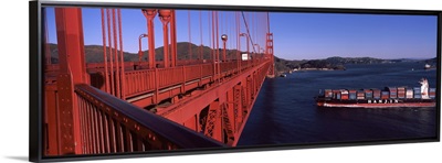 Container ship passing under a suspension bridge Golden Gate Bridge San Francisco Bay San Francisco California