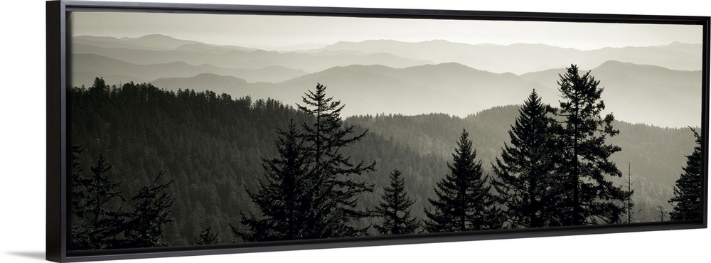 Panoramic monochromatic photograph displays a view overlooking the layered mountain ranges within a region of the Southeas...