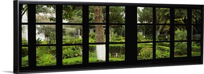 Formal garden viewed through a window, Hosteria La Cienega, Latacunga, Cotopaxi, Ecuador