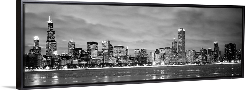 Black and White panoramic photograph showing the view from Lake Michigan in winter of the Chicago skyline of the downtown ...