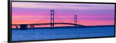 Silhouette of a suspension bridge at sunset Mackinac Bridge Michigan