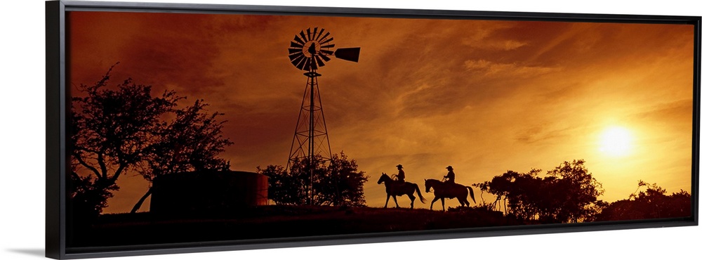 Landscape, panoramic artwork of a hill with a windmill perched at the top on a farm at twilight.