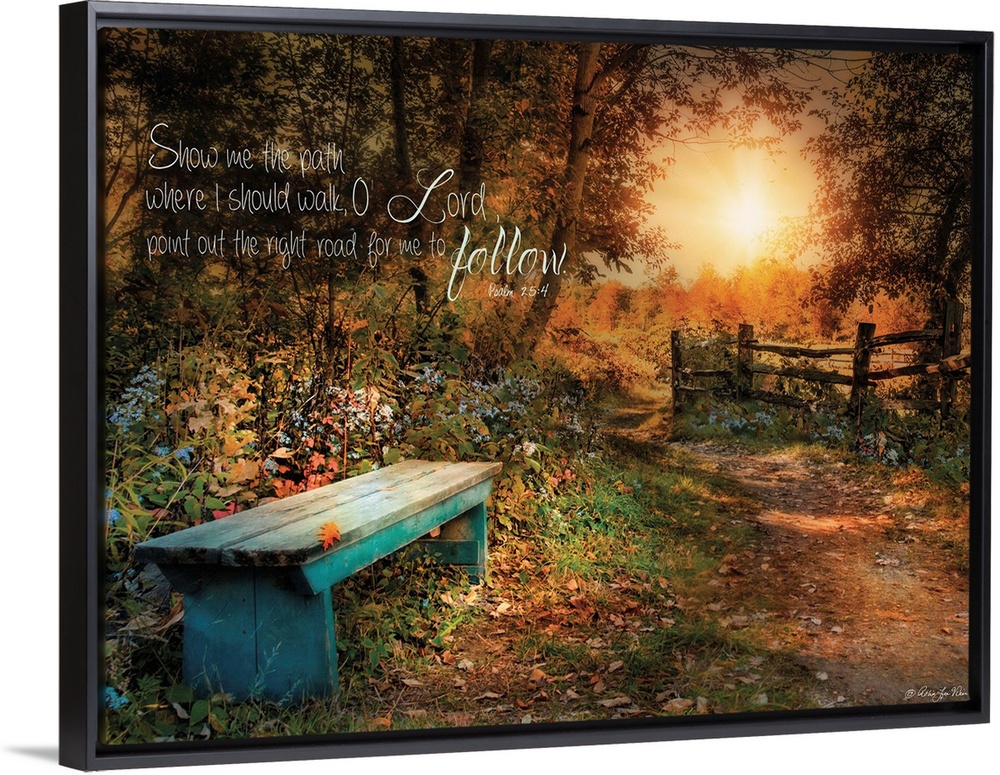 A small bench in the woods near a fence at sunset, with a bible verse.