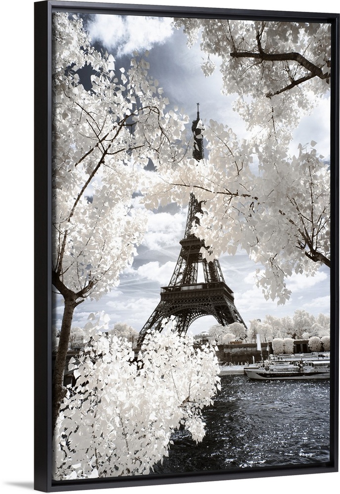 A view of the Eiffel Tower in Paris, made in infrared mode in summer. The vegetation is white and rendering of the sky is ...