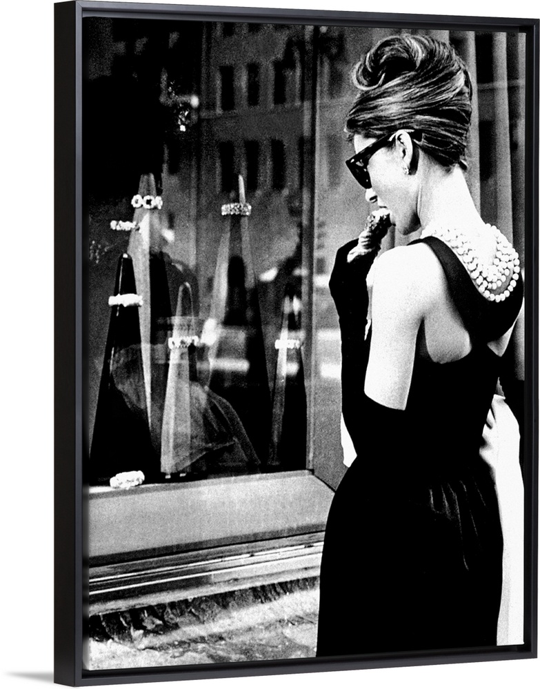 Big photograph showcases a famous Hollywood actress as she stares through an outdoor display case of jewelry.  This Britis...