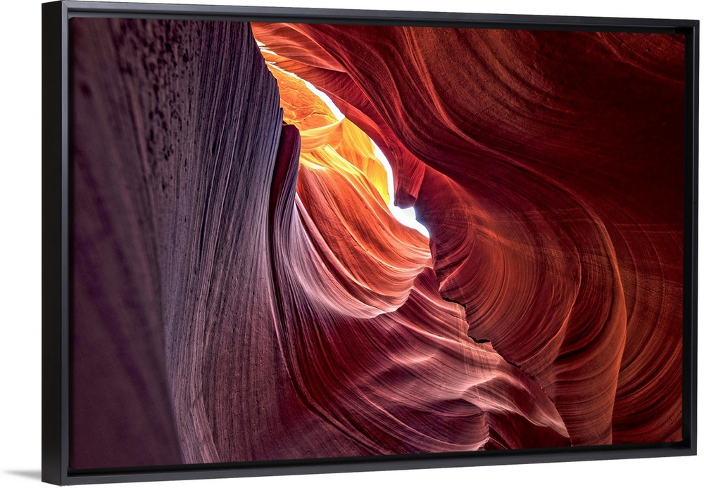 Photograph from inside of Antelope Canyon rock formation located on the Navajo Reservation in Page, Arizona with colorful ...