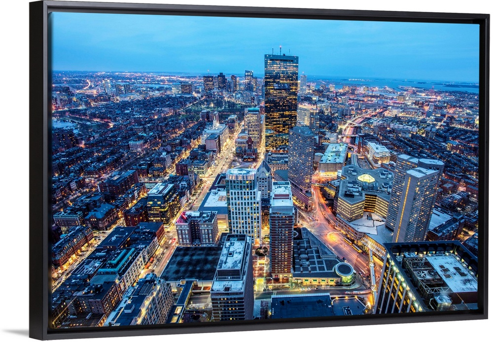 Photo of Boston cityscape at night featuring the John Hancock Tower.