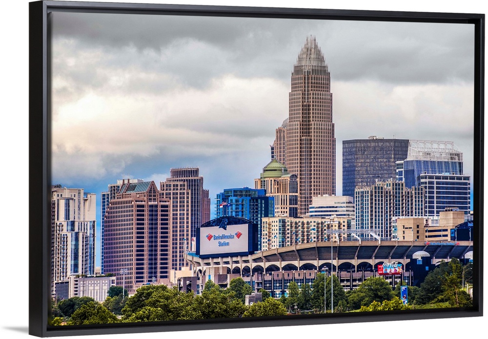 Horizontal image of the city of Charlotte, North Carolina with a cloudy sky.