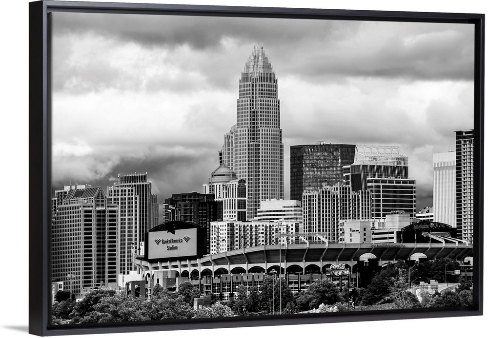 Horizontal image of the city of Charlotte, North Carolina with a cloudy sky.