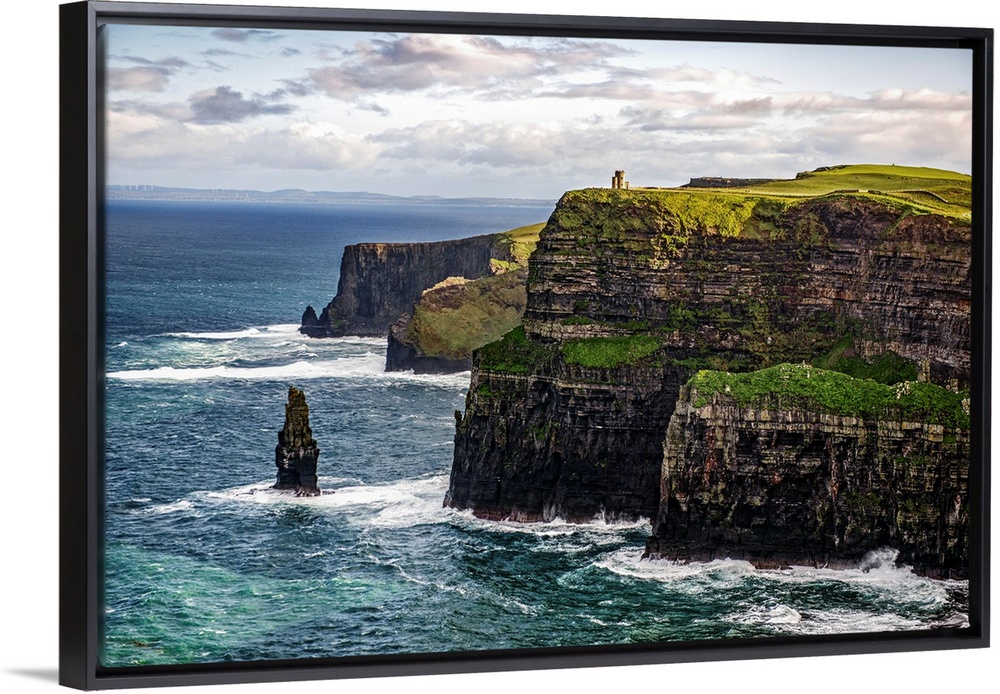 Photograph of the Cliffs of Moher with O'Brien's Tower seen in the distance, marking the highest point of the Cliffs of Mo...
