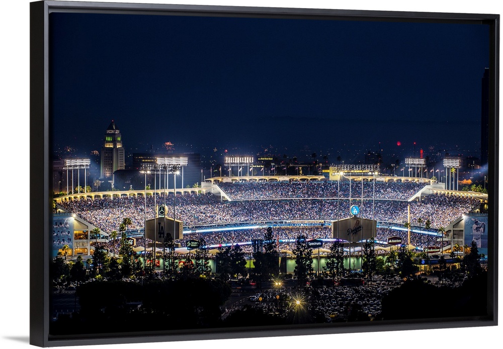 Photograph of Dodger Stadium lit up on a game night.