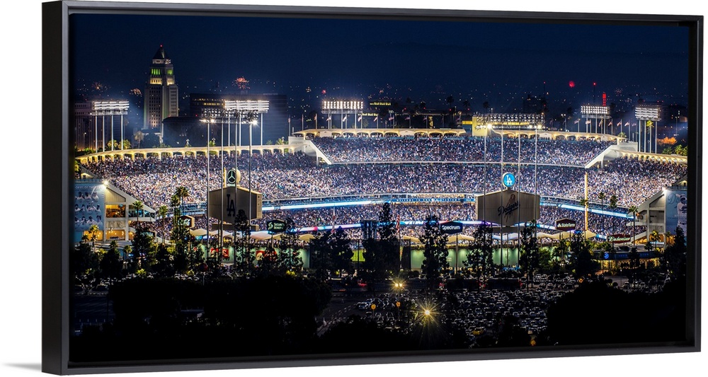 Panoramic photograph of Dodger Stadium lit up on a game night.