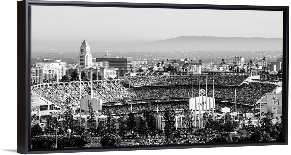 Panoramic photograph of Dodger Stadium lit up on a game night.