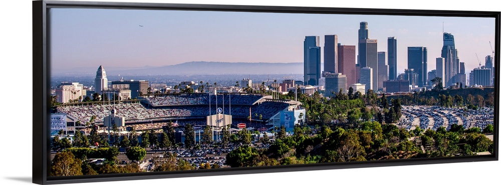 Panoramic photograph of the downtown Los Angeles skyline with Dodger Stadium on the left.