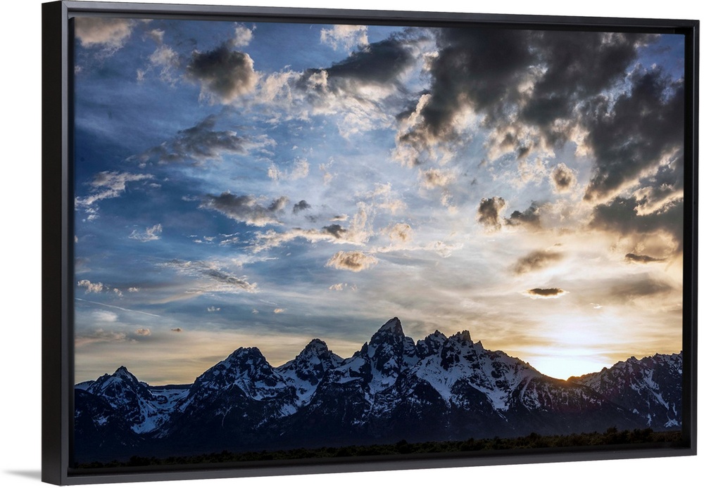View of dramatic clouds over Teton mountains in Wyoming.