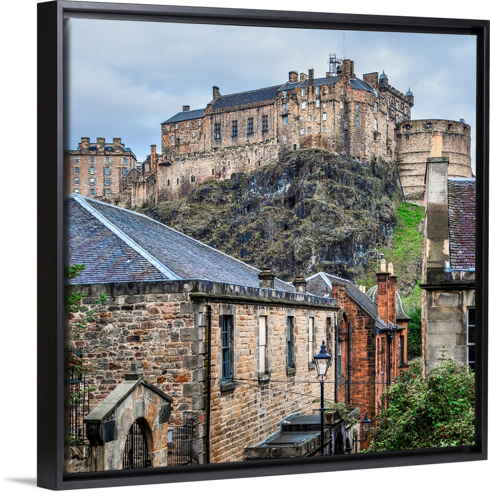 Square photograph of the Edinburgh Castle with old stone buildings in the foreground, Edinburgh, Scotland, UK