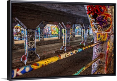 Graffiti covering the columns and railings in the Krog Street Tunnel in Atlanta, Georgia