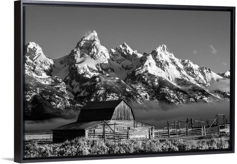 The John Moulton barn sits against a picturesque landscape of the Teton mountain range in Wyoming.