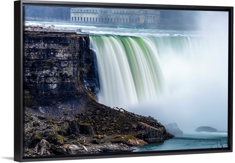 View of Horseshoe Falls at Niagara Falls with former Toronto power generating station in the background.