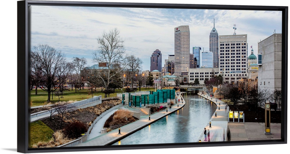Photo of the Indianapolis city skyline reflecting onto the Indiana Central Canal.