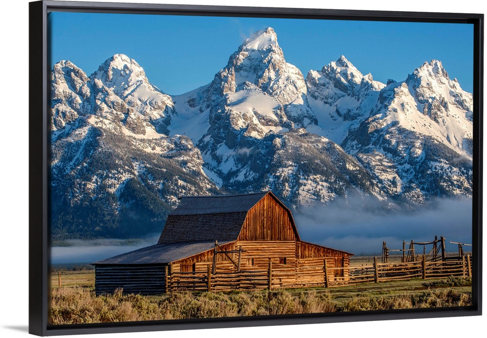 View of the John Moulton Barn with Middle Teton, Grand Teton and Mount Owen in the background. Grand Teton National Park, ...