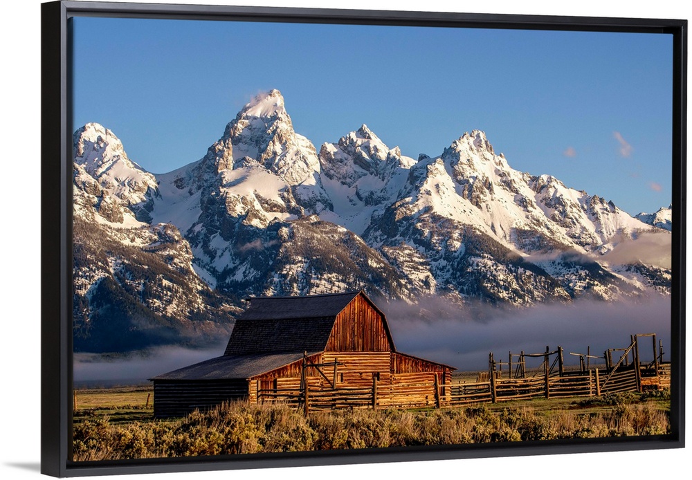 View of the John Moulton Barn with Middle Teton, Grand Teton and Mount Owen in the background. Grand Teton National Park, ...