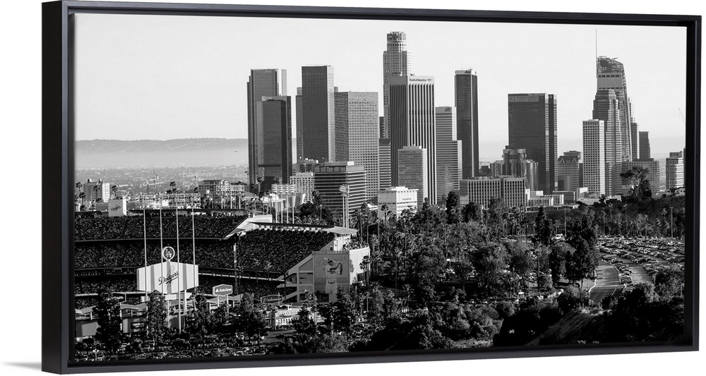 Photograph of the downtown Los Angeles skyline with Dodger Stadium on the left.