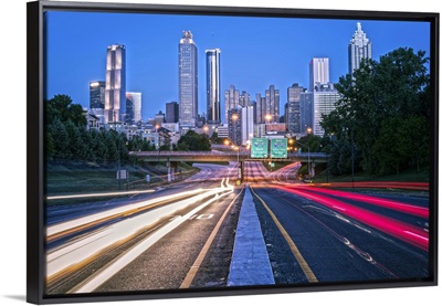 Light trails from traffic with the Atlanta, Georgia skyline at dusk