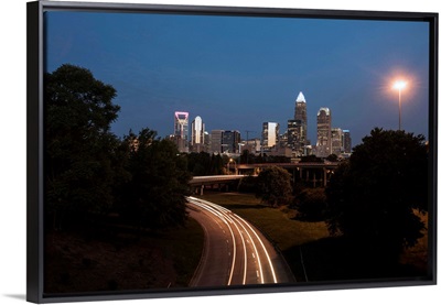 Light Trails Near Charlotte City Skyline At Night, North Carolina