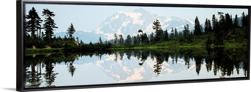 Panoramic photograph of Mt. Shuksan reflecting into Picture Lake around sunset.