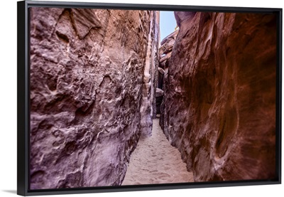 Narrow trail between red sandstone fins, Arches National Park, Utah
