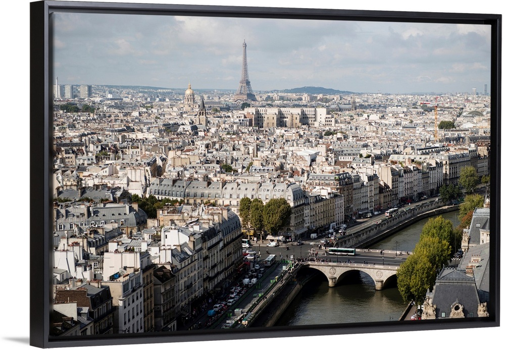 Photograph of a Paris Cityscape with the Eiffel Tower towering over the city.