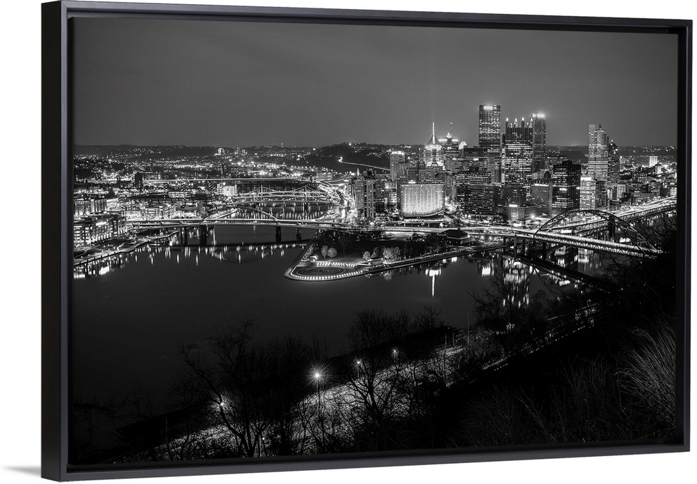 Photo of downtown Pittsburgh at night with Point State park.