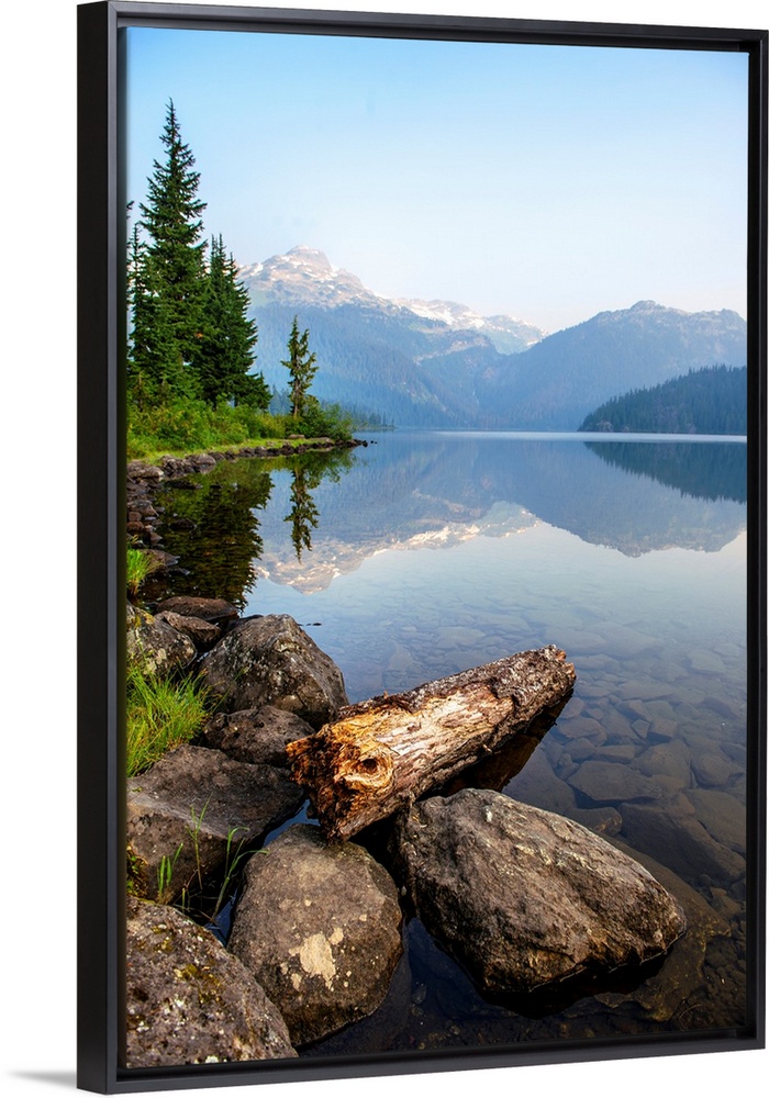 Reflection on Callaghan Lake with Rocks in British Columbia, Canada.
